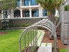 Kiawah_custom metal arbor tunnel with misters in backyard