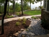 paris mountain_greenville_south carolina_rock swale with stone walkway through plant bed