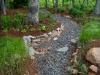 paris mountain_greenville_south carolina_stone swale through trees with native grasses and native plants