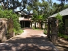 Shedlarz_entryway with custom brick collumns and iron gates.jpg